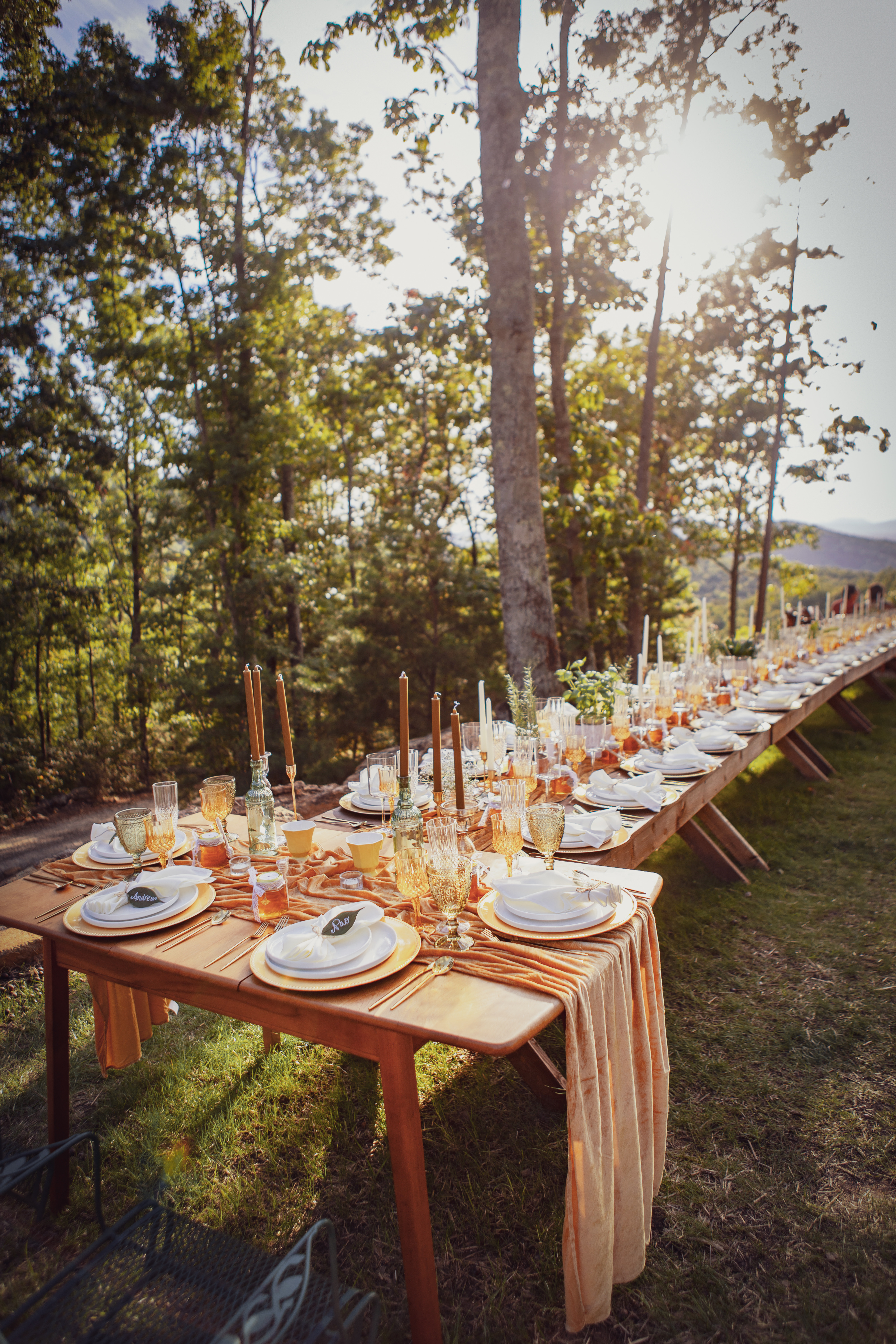 Reception tables set with vintage decor and candlelight at Secluded Ridge